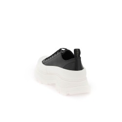 tread slick sneakers with graffiti logo