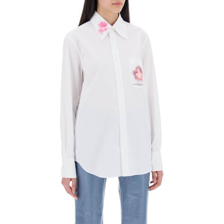 "shirt with flower print patch and embroidered logo