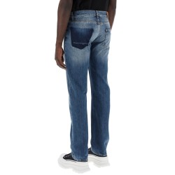 straight leg jeans with faux pocket on the back.