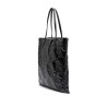 Black embossed leather handbag