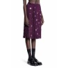 midi-skirt with fringe and grommet embellishment