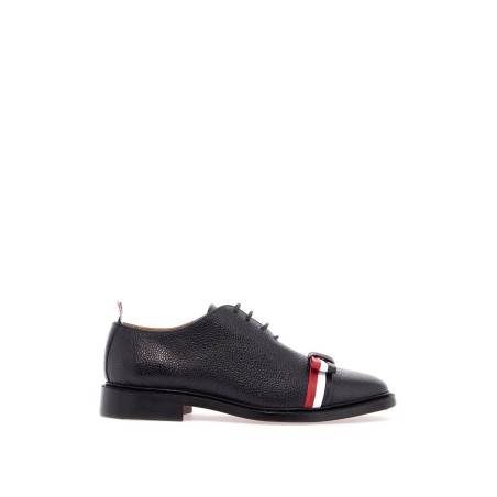 elegant wholecut shoes in black calfskin with rwb bow