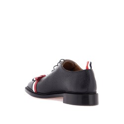 elegant wholecut shoes in black calfskin with rwb bow