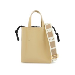 beige leather shopping bag with short handles and shoulder strap