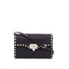 small black leather shoulder bag with golden studs