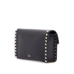 small black leather shoulder bag with golden studs