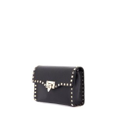 small black leather shoulder bag with golden studs