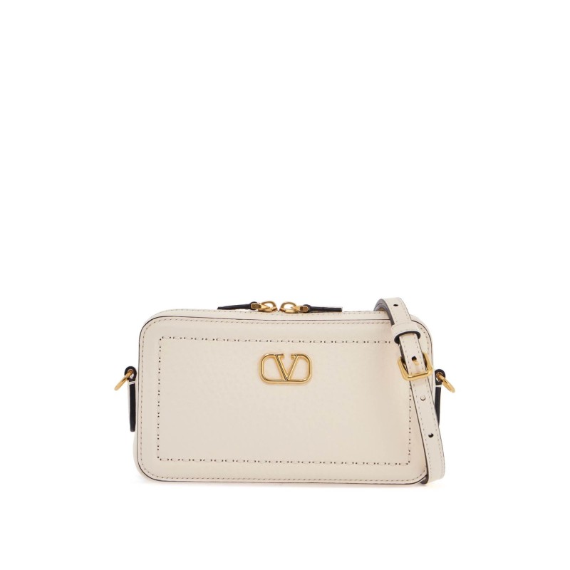 mini camera case in ivory leather with adjustable strap and golden details