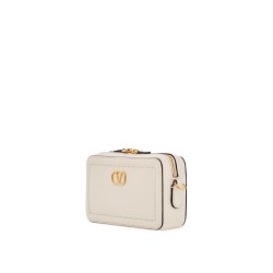 mini camera case in ivory leather with adjustable strap and golden details