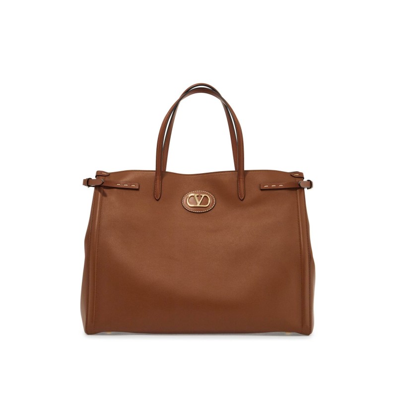 borsa tote grande in pelle marrone minimalista con fibbie decorative