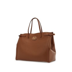 borsa tote grande in pelle marrone minimalista con fibbie decorative