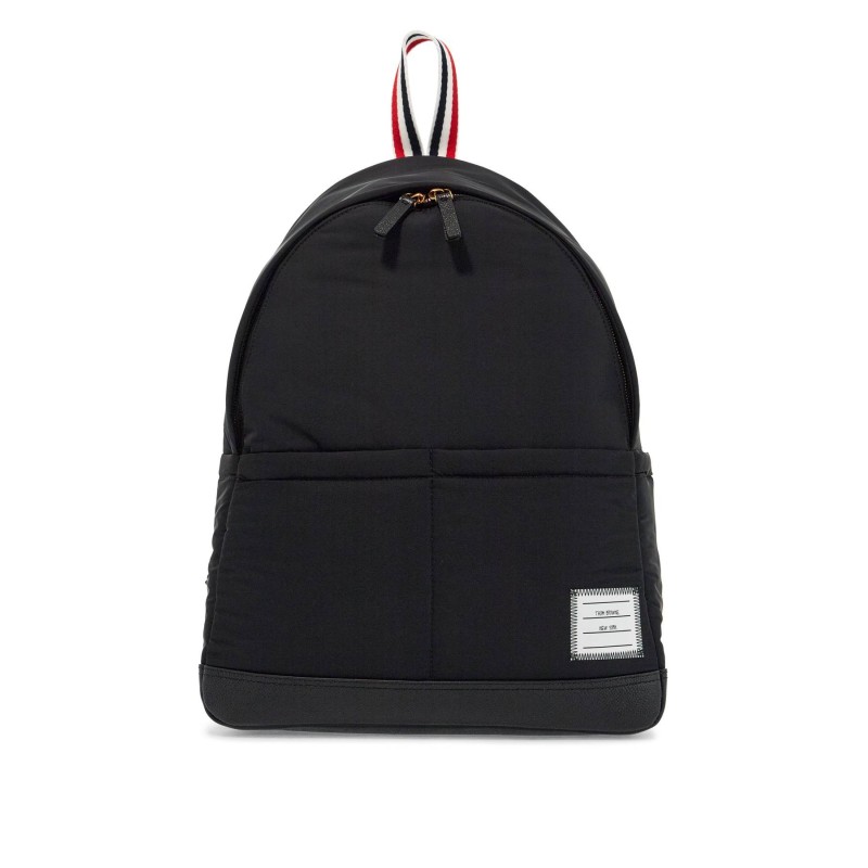 black multipocket backpack in polyester and leather with adjustable straps