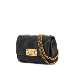 small black quilted shoulder bag with gold chain