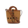 light brown woven fabric and leather bag with circular handles