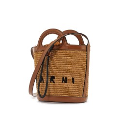 light brown woven fabric and leather bag with circular handles