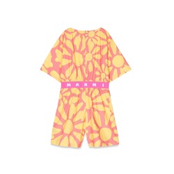 mc jumpsuit and patterned shorts