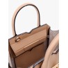 Leather handbag with frontal walker and strap