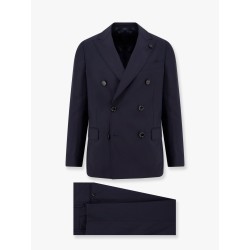 Double-breasted wool suit with iconic brooch