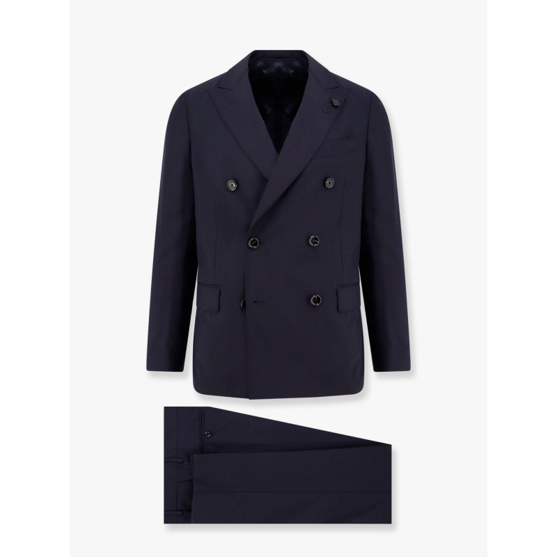 Double-breasted wool suit with iconic brooch