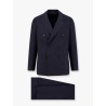 Double-breasted wool suit with iconic brooch
