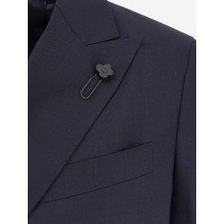Double-breasted wool suit with iconic brooch