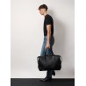 Leather duffle bag with suede inserts and logo patch