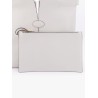 Leather handbag with frontal logo patch