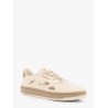 Low-top sneakers realized with foam with lateral openwork
