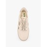 Low-top sneakers realized with foam with lateral openwork