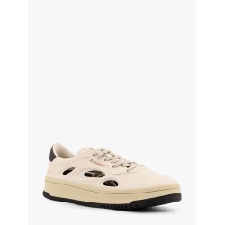 Low-top sneakers realized with foam with lateral openwork
