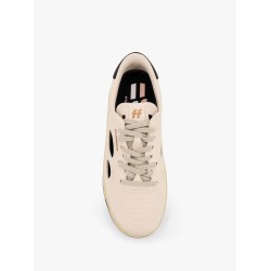 Low-top sneakers realized with foam with lateral openwork