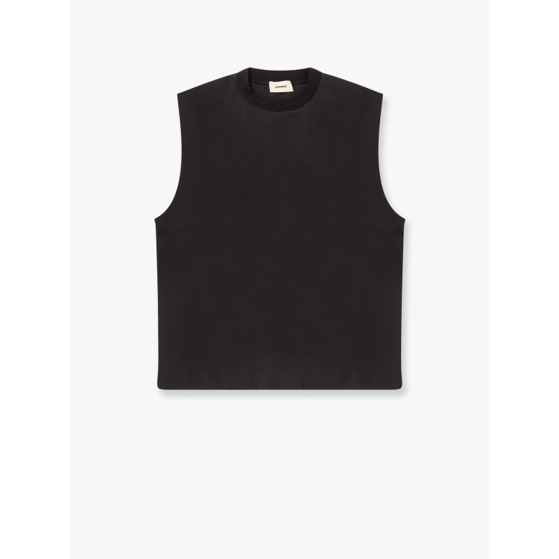 Modal top with rhinestone logo patch on the back