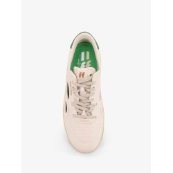 Low-top sneakers realized with foam with lateral openwork