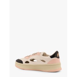 Low-top sneakers realized with foam with lateral openwork