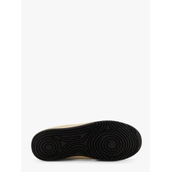 Low-top sneakers realized with foam with lateral openwork