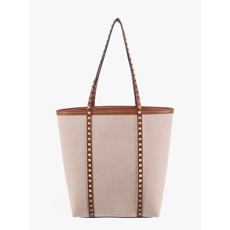 Leather and canvas shoulder bag with iconic studs