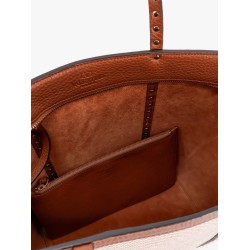 Leather and canvas shoulder bag with iconic studs