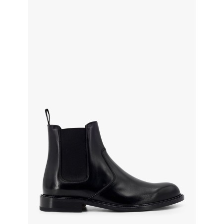 Shiny leather boots with engraved logo on the side