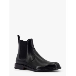 Shiny leather boots with engraved logo on the side