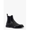 Shiny leather boots with engraved logo on the side