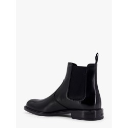 Shiny leather boots with engraved logo on the side