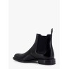 Shiny leather boots with engraved logo on the side