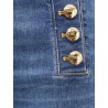 Stretch denim jeans with metal buttons