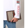 Gg supreme fabric and leather clutch with frontal web band