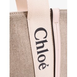 Linen shoulder bag with logo print.this bag is made with lower environmental impact material
