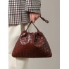 Leather clutch with intrecciato motif