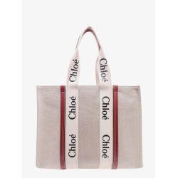 Linen shoulder bag with logo print. this bag is made with lower environmental impact material