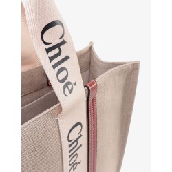 Linen shoulder bag with logo print. this bag is made with lower environmental impact material