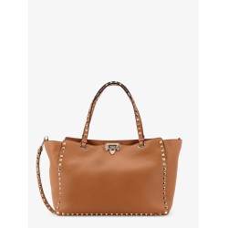 Hammered leather shoulder bag with iconic studs, metal hook closure and removable shoulder strap