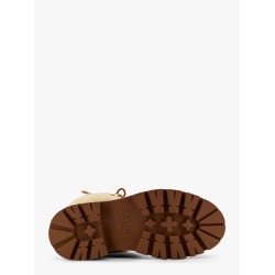 Bulky leather boots with triomphe all-over motif